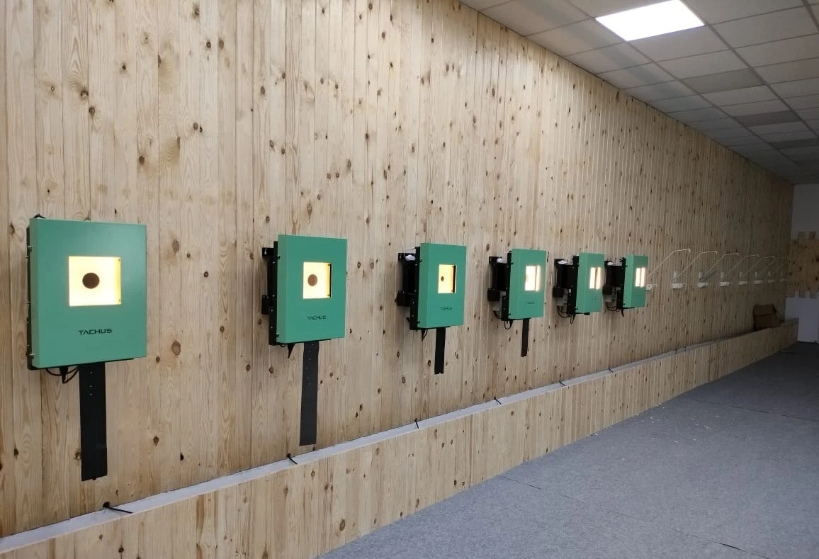 Tachus 10 electronic target units installed along an indoor range wall