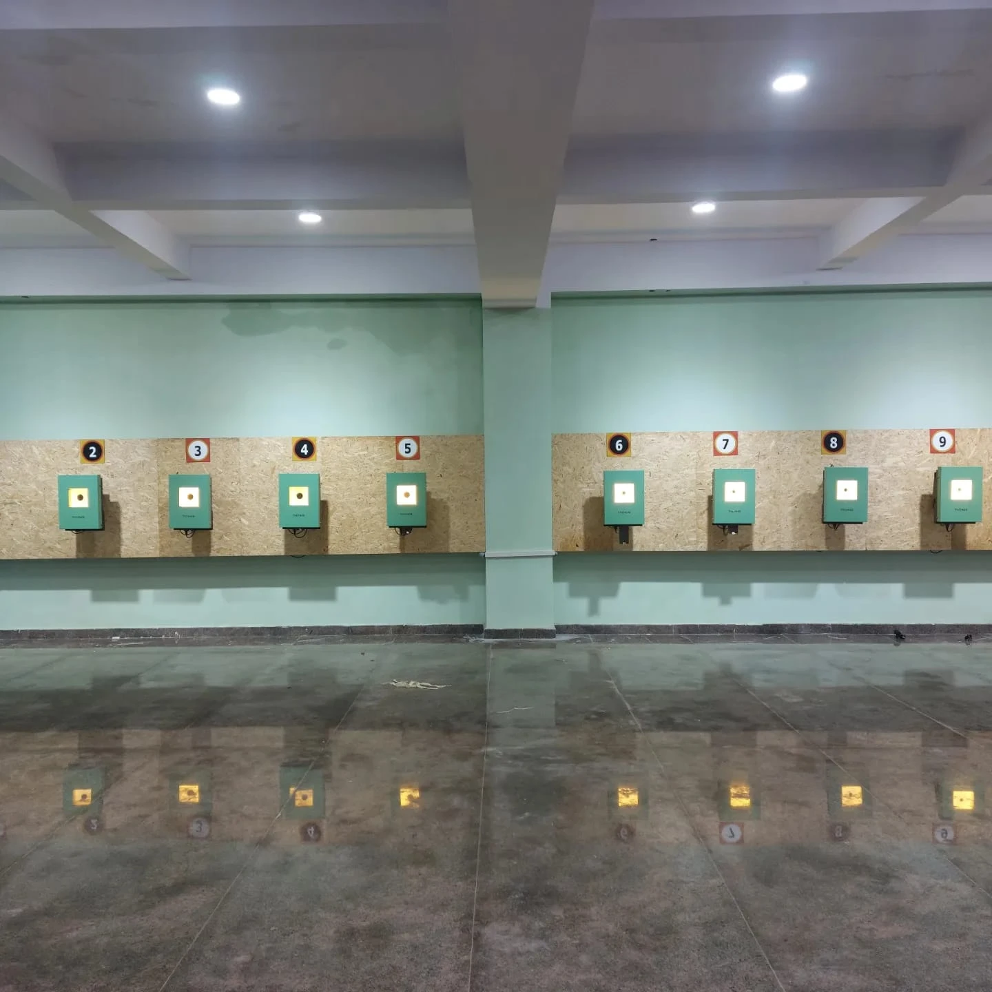 Tachus 10 electronic targets installed across an indoor range