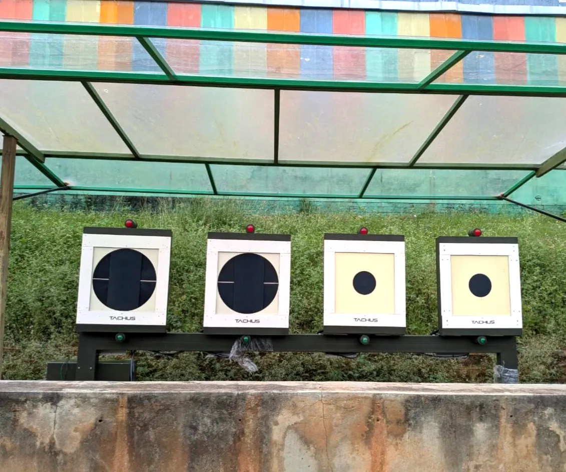 Four Tachus 25 electronic target units installed at an outdoor shooting range