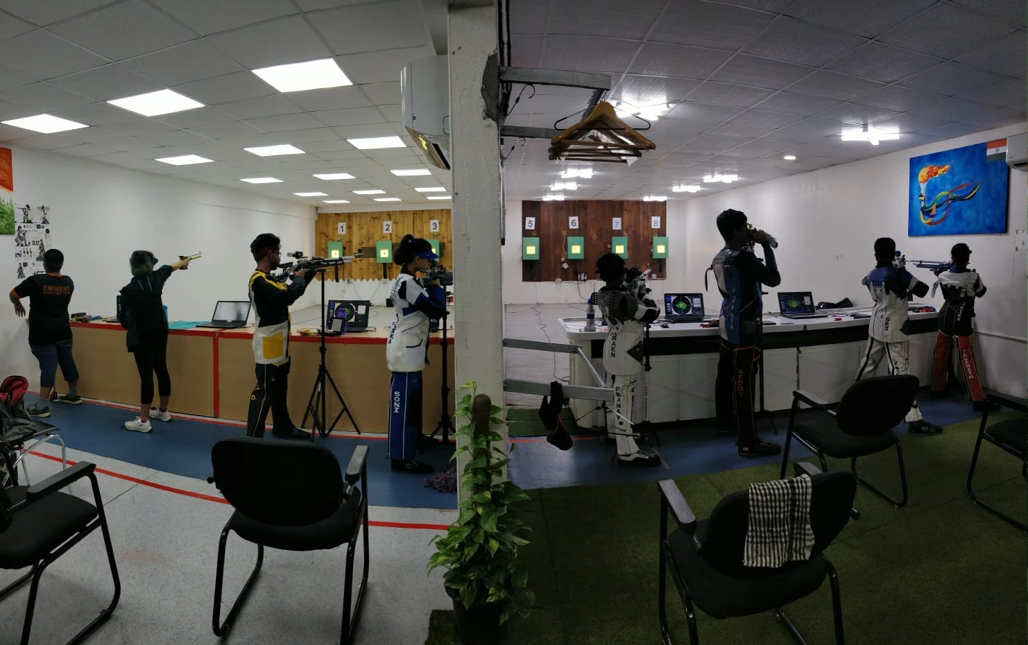 Shooters training across multiple lanes at a Tachus academy range