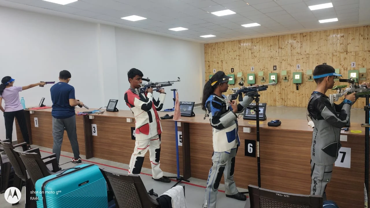 Athletes training on Tachus electronic target lanes in an indoor academy