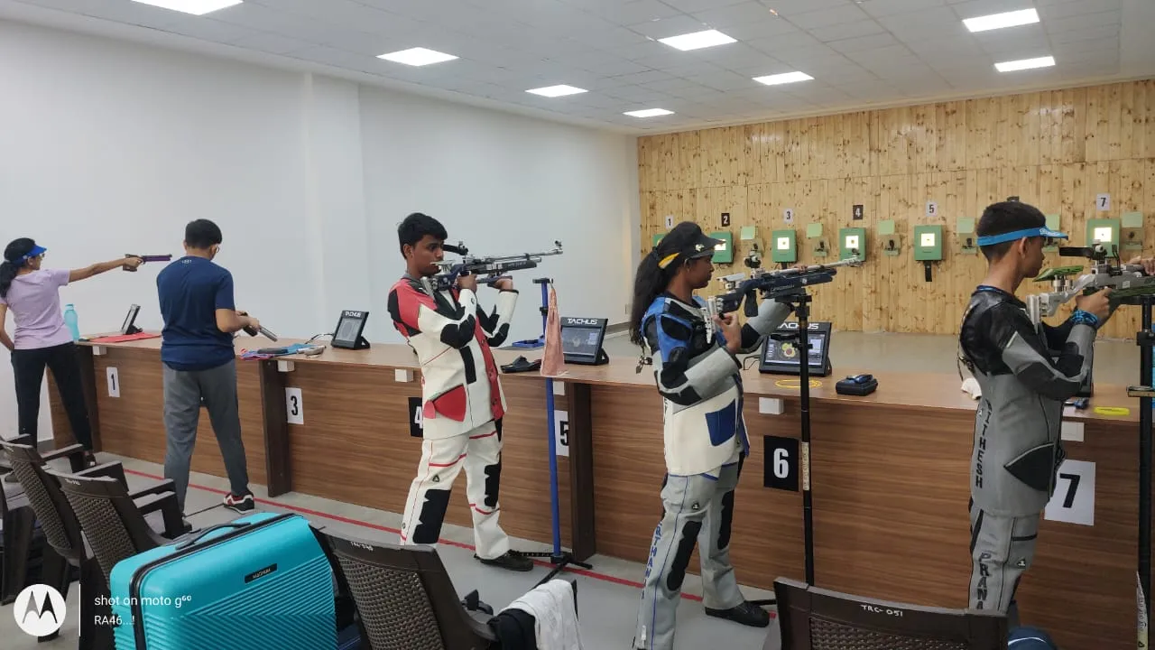 Athletes training on Tachus electronic target lanes in an indoor academy
