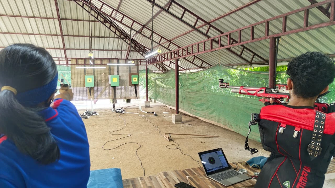Air pistol and air rifle shooters training with Tachus electronic targets in a covered range